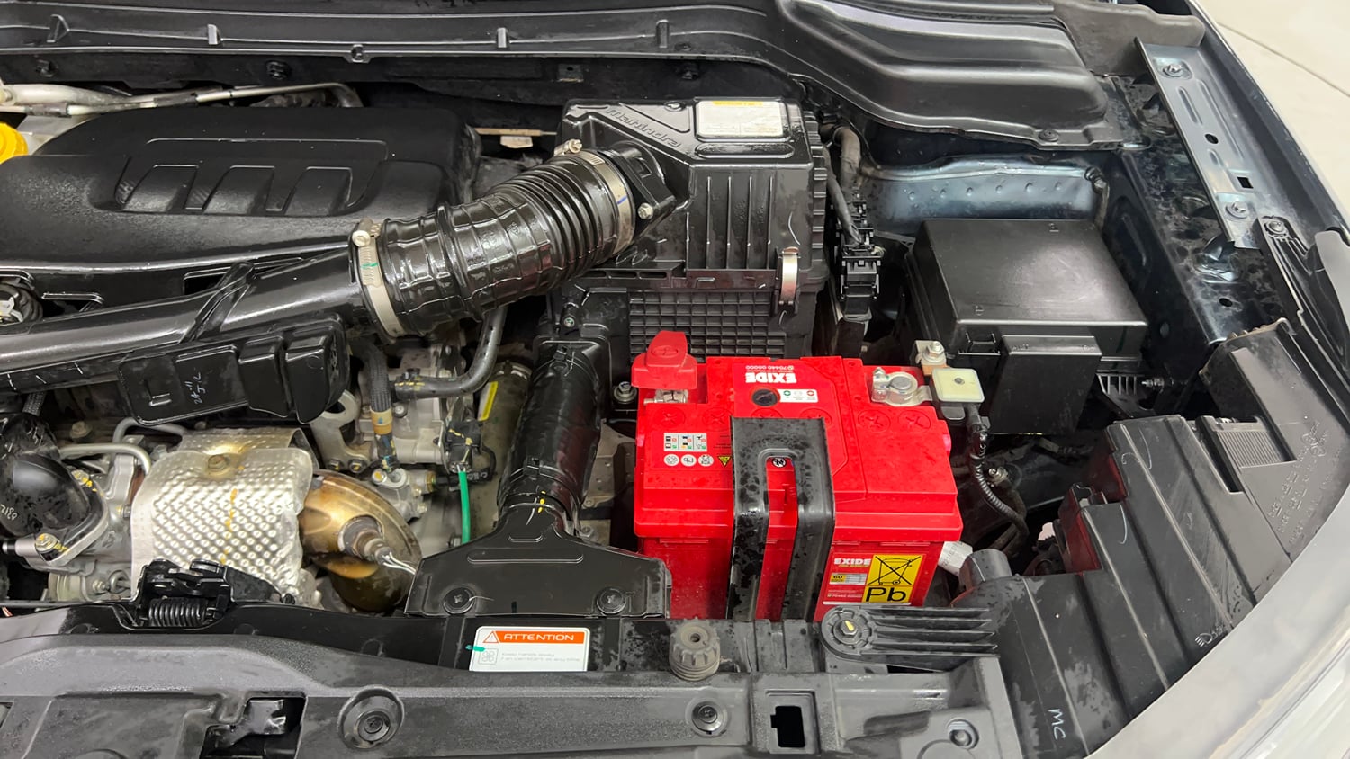 Used 2023 Mahindra XUV 300 W8 (O) 1.2 Petrol AMT Petrol Automatic engine ENGINE LEFT SIDE VIEW