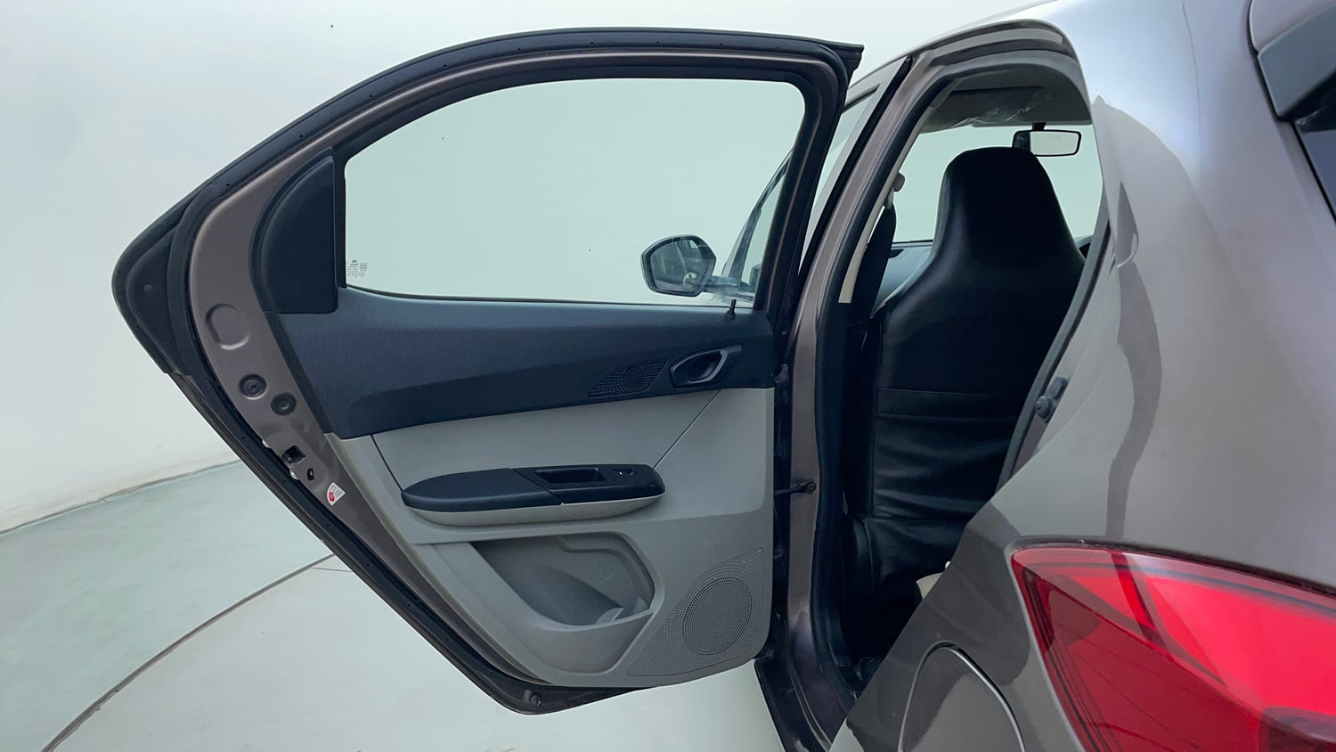 Used 2016 Tata Tiago Revotron XM Petrol Manual interior LEFT REAR DOOR OPEN VIEW