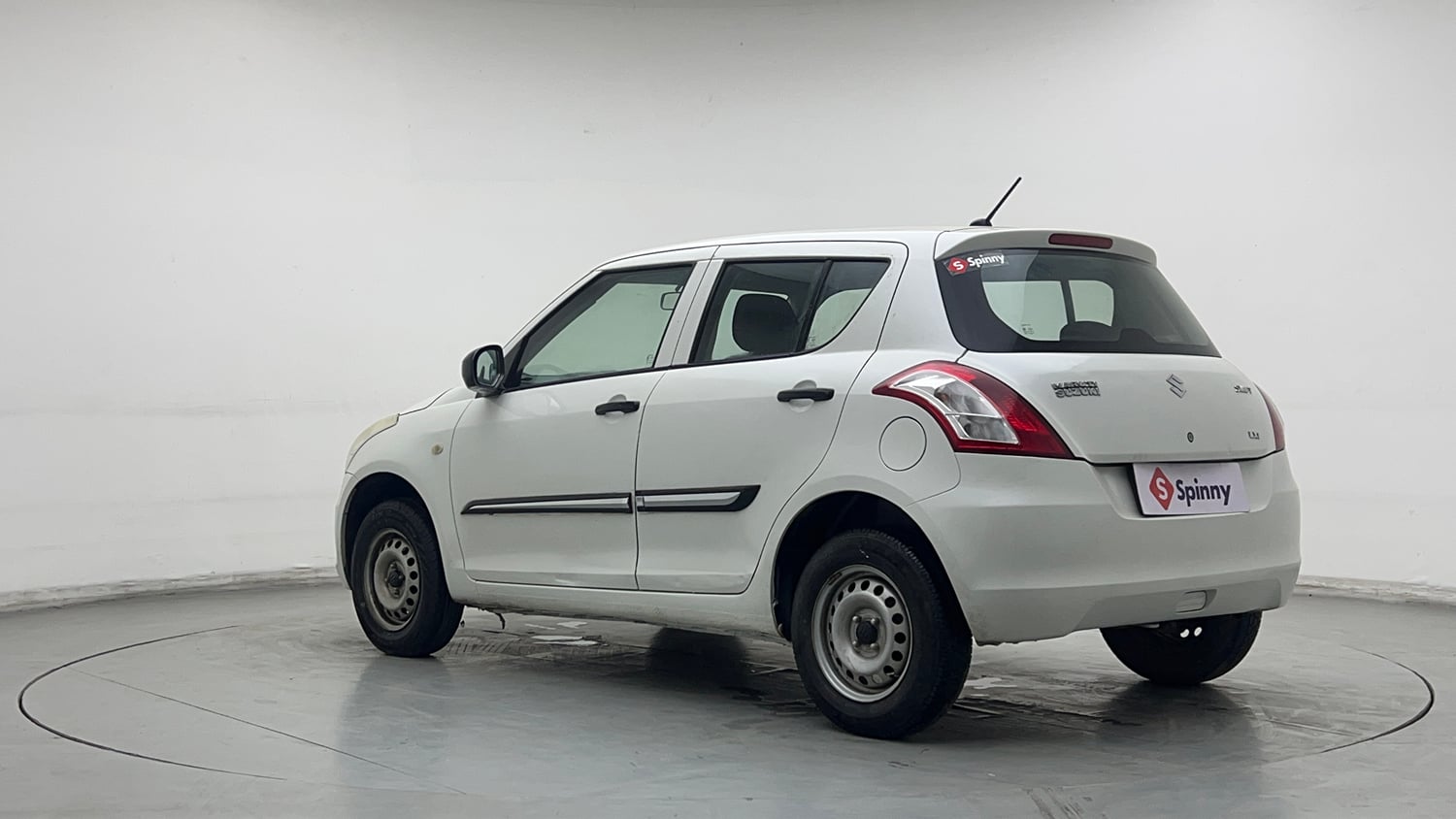 Used 2016 Maruti Suzuki Swift Lxi (O) Petrol Manual exterior LEFT REAR CORNER VIEW