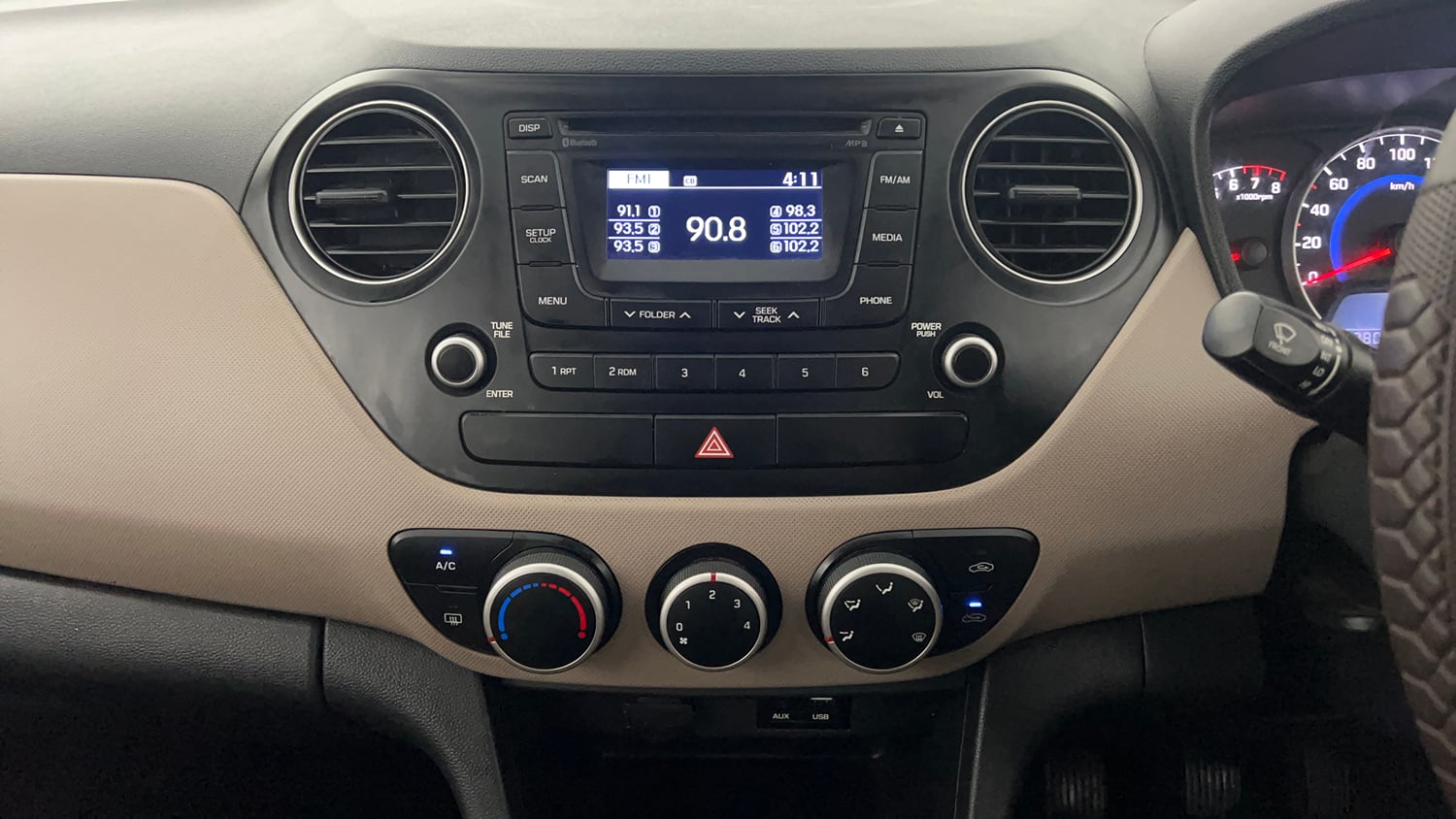 Used 2016 Hyundai Grand i10 Sportz 1.2 Kappa VTVT Petrol Manual interior MUSIC SYSTEM & AC CONTROL VIEW