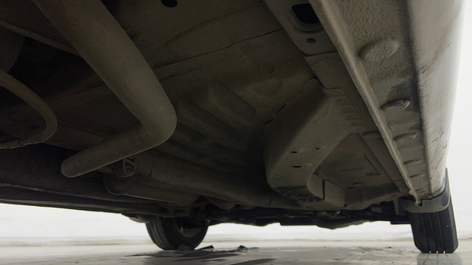 Used 2013 Honda Brio V MT Petrol Manual extra REAR RIGHT UNDERBODY VIEW