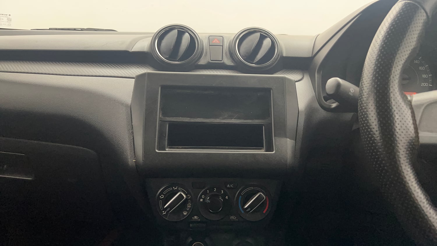 Used 2021 Maruti Suzuki Swift LXi Petrol Manual interior MUSIC SYSTEM & AC CONTROL VIEW