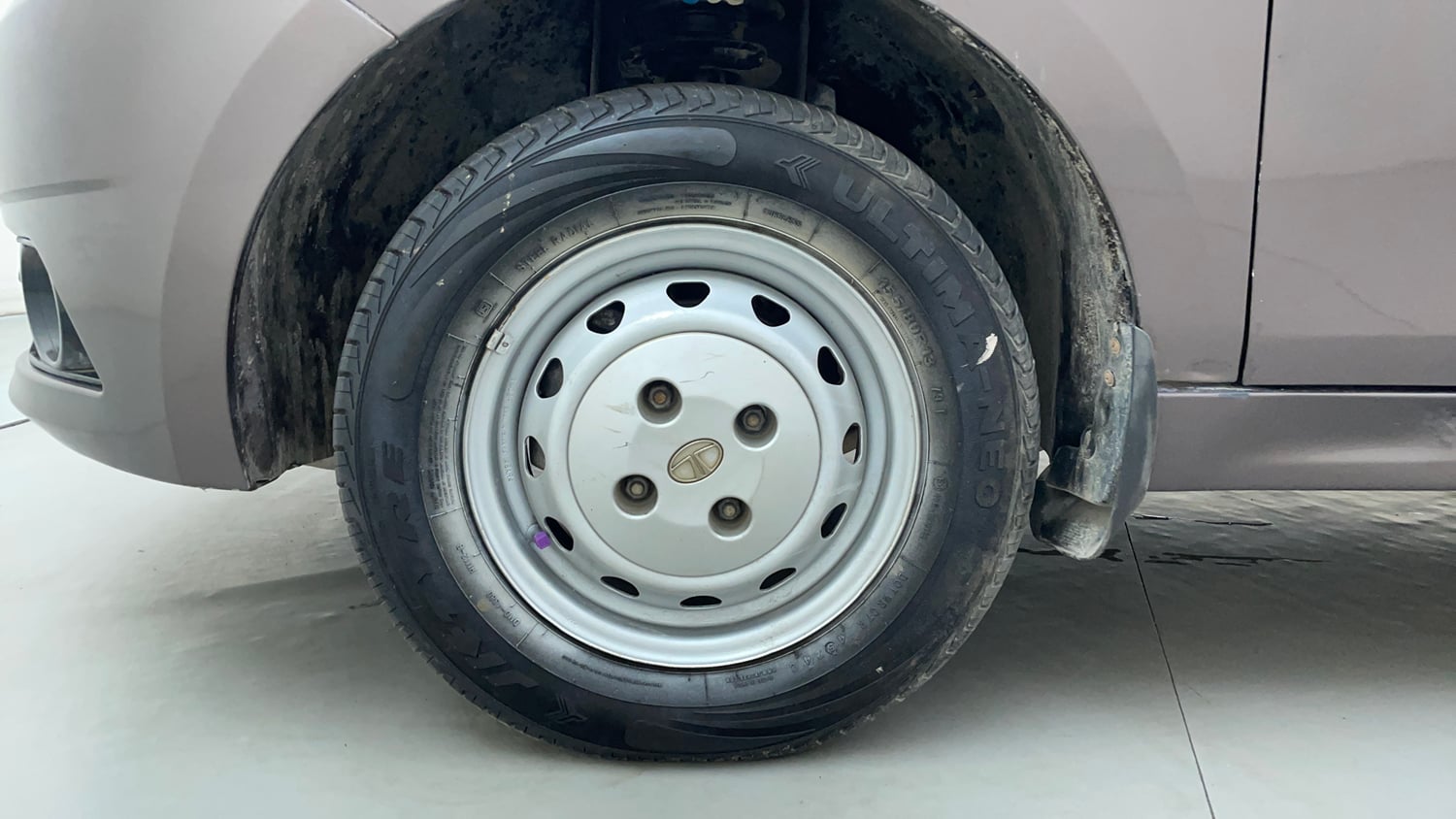 Used 2016 Tata Tiago Revotron XM Petrol Manual tyres LEFT FRONT TYRE RIM VIEW