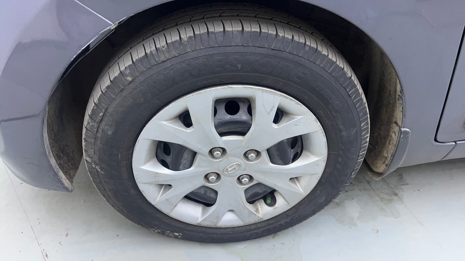 Used 2014 Hyundai Grand i10 Sportz AT 1.2 Kappa VTVT Petrol Automatic tyres LEFT FRONT TYRE RIM VIEW