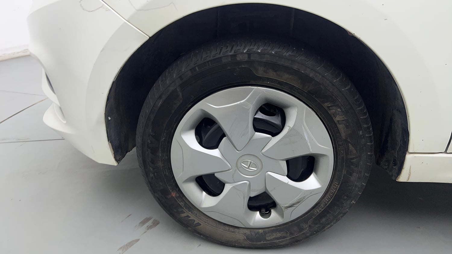 Used 2023 Tata Tiago XT (O) Petrol Manual tyres LEFT FRONT TYRE RIM VIEW