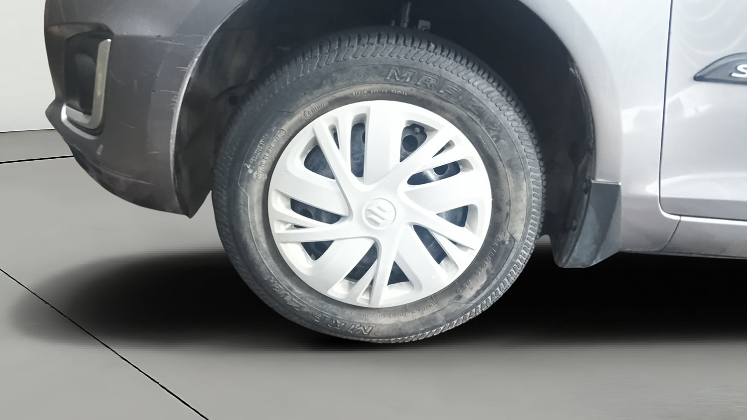 Used 2015 Maruti Suzuki Swift VXi Petrol Manual tyres LEFT FRONT TYRE RIM VIEW