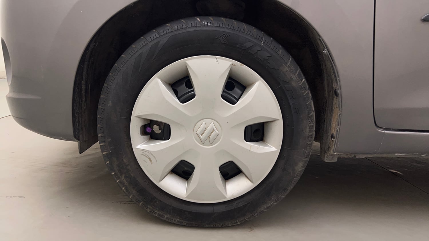 Used 2014 Maruti Suzuki Celerio VXi Petrol Manual tyres LEFT FRONT TYRE RIM VIEW