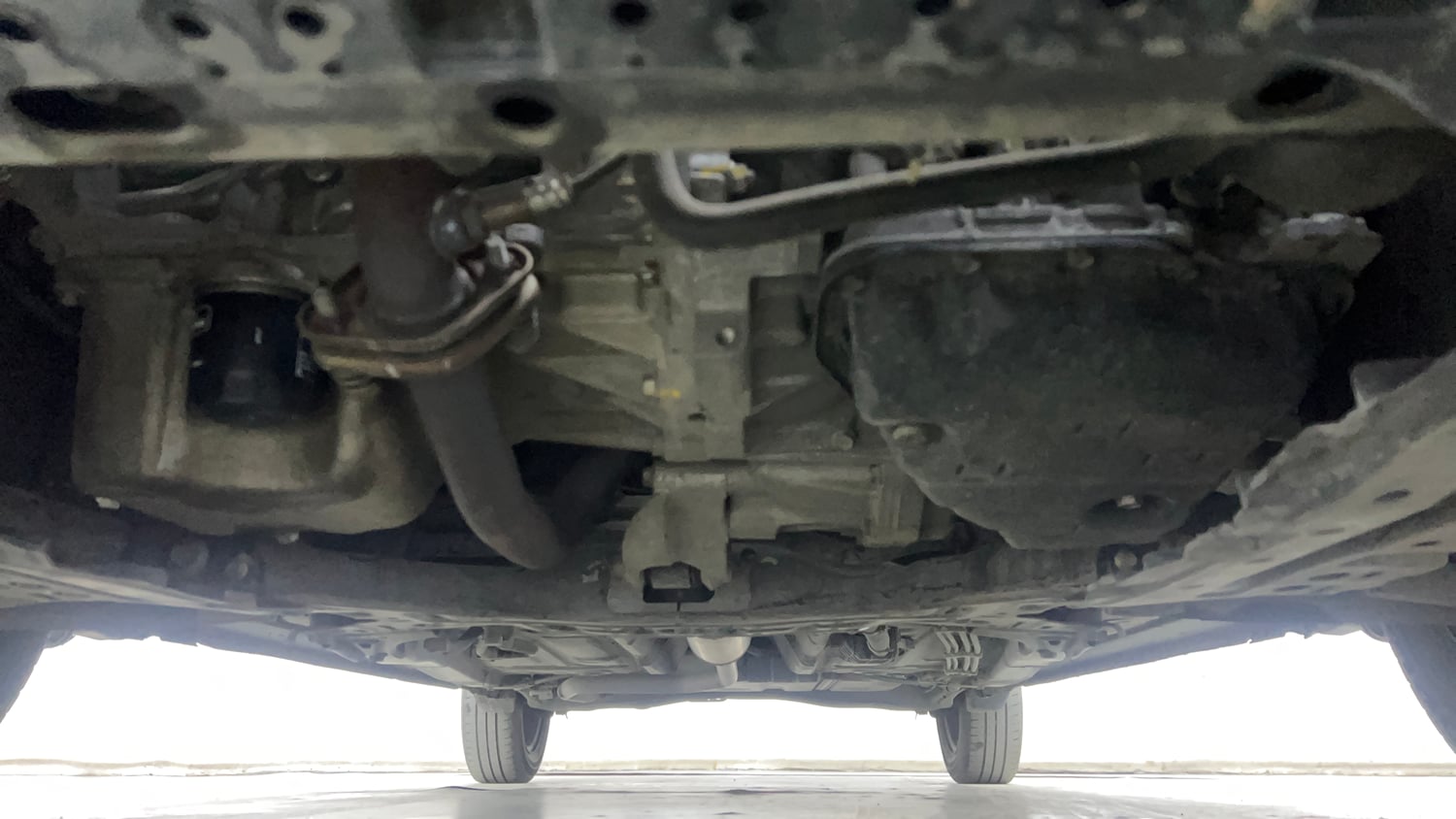 Used 2022 Maruti Suzuki New Ertiga VXi AT Petrol Automatic extra FRONT LEFT UNDERBODY VIEW