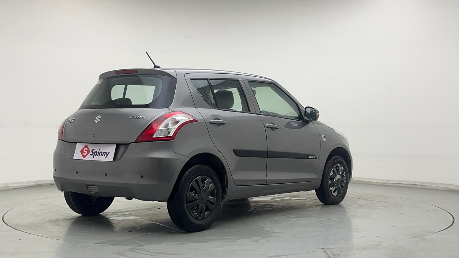 Used 2015 Maruti Suzuki Swift Lxi (O) Petrol Manual exterior RIGHT REAR CORNER VIEW