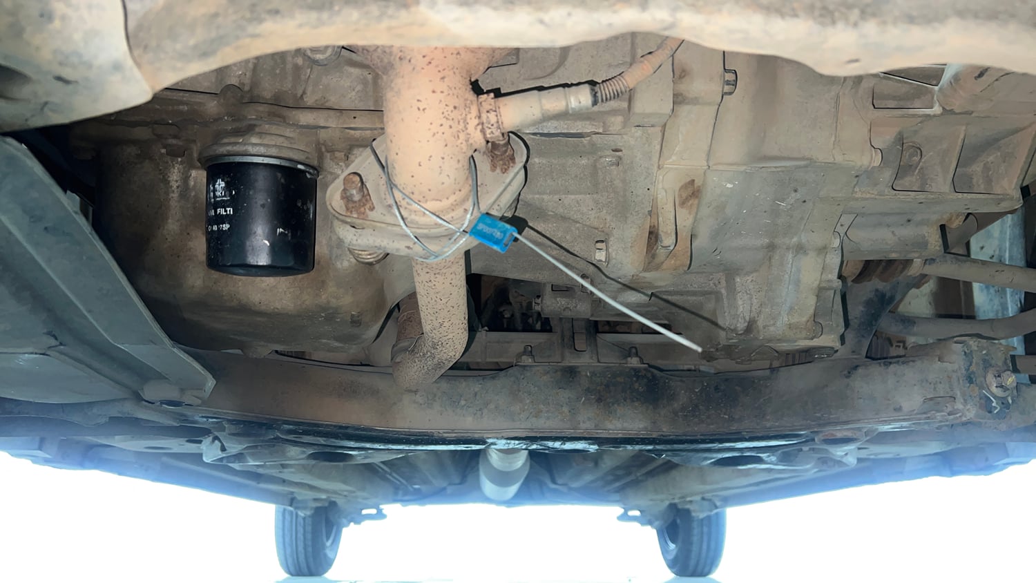 Used 2015 Maruti Suzuki Swift Lxi (O) Petrol Manual extra FRONT LEFT UNDERBODY VIEW