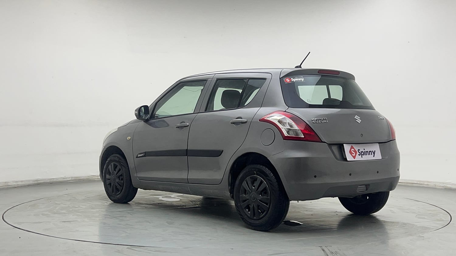 Used 2015 Maruti Suzuki Swift Lxi (O) Petrol Manual exterior LEFT REAR CORNER VIEW