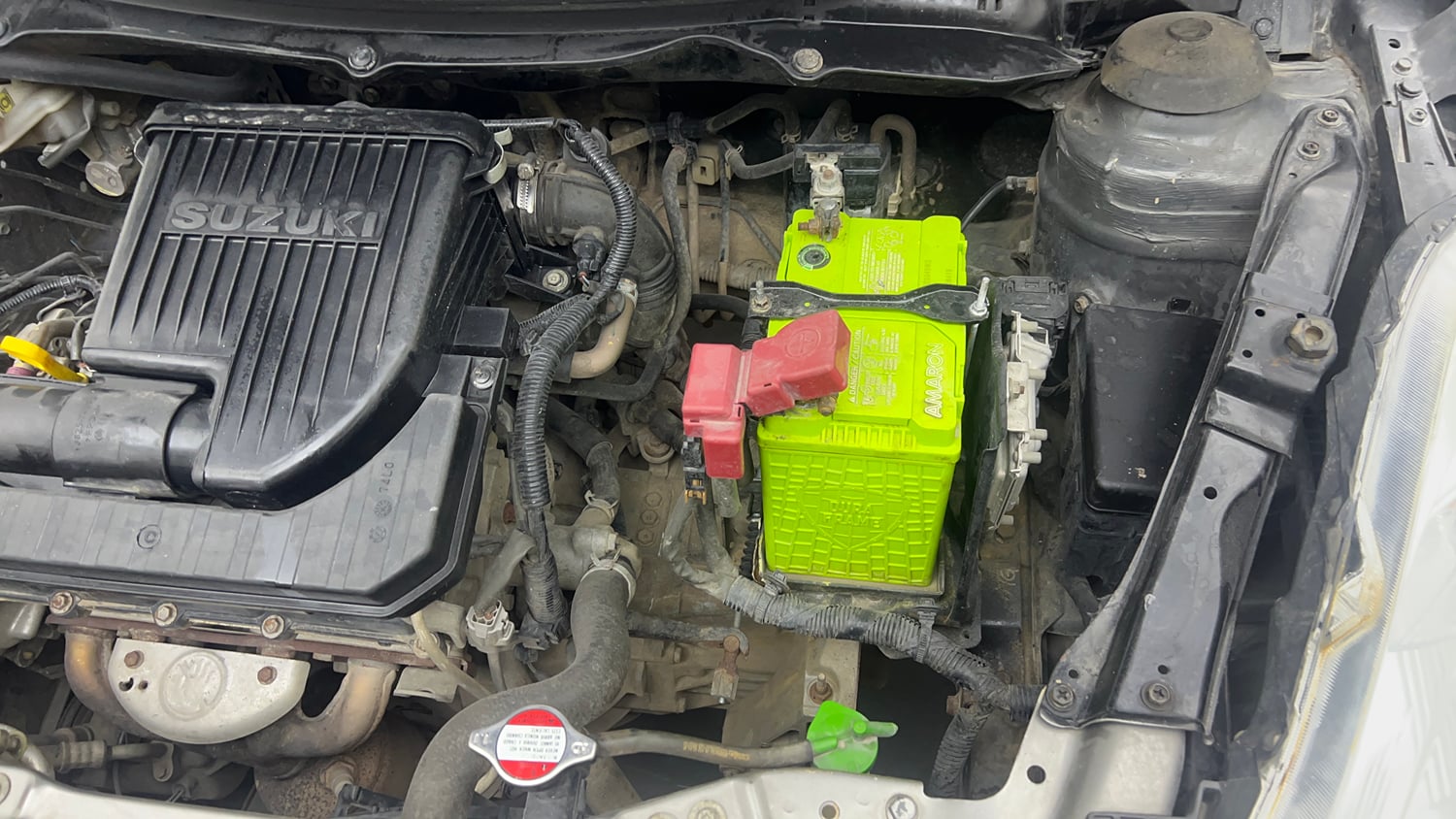 Used 2015 Maruti Suzuki Swift Lxi (O) Petrol Manual engine ENGINE LEFT SIDE VIEW