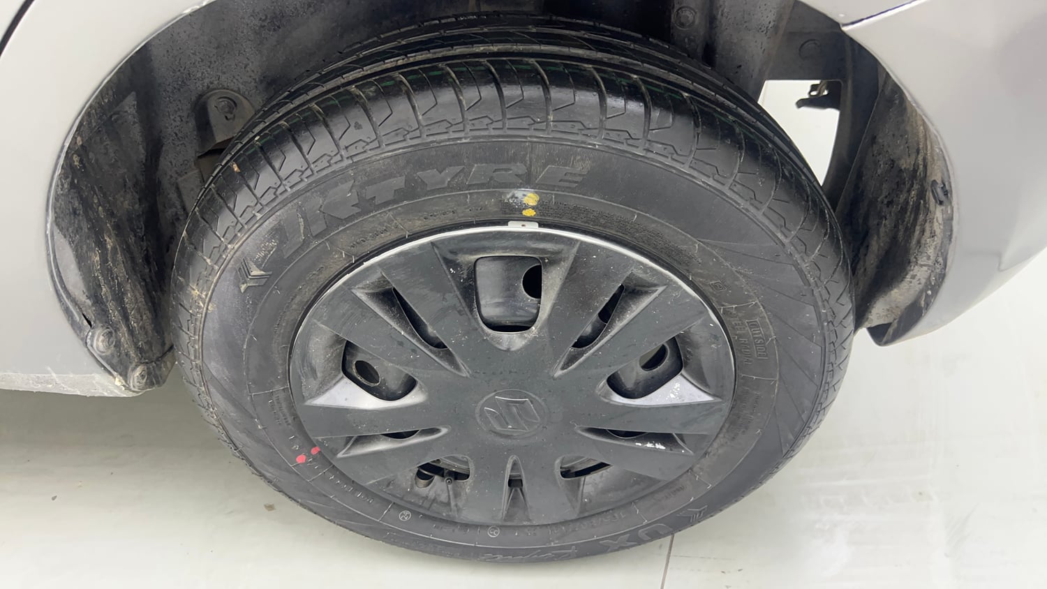 Used 2015 Maruti Suzuki Swift Lxi (O) Petrol Manual tyres LEFT REAR TYRE RIM VIEW