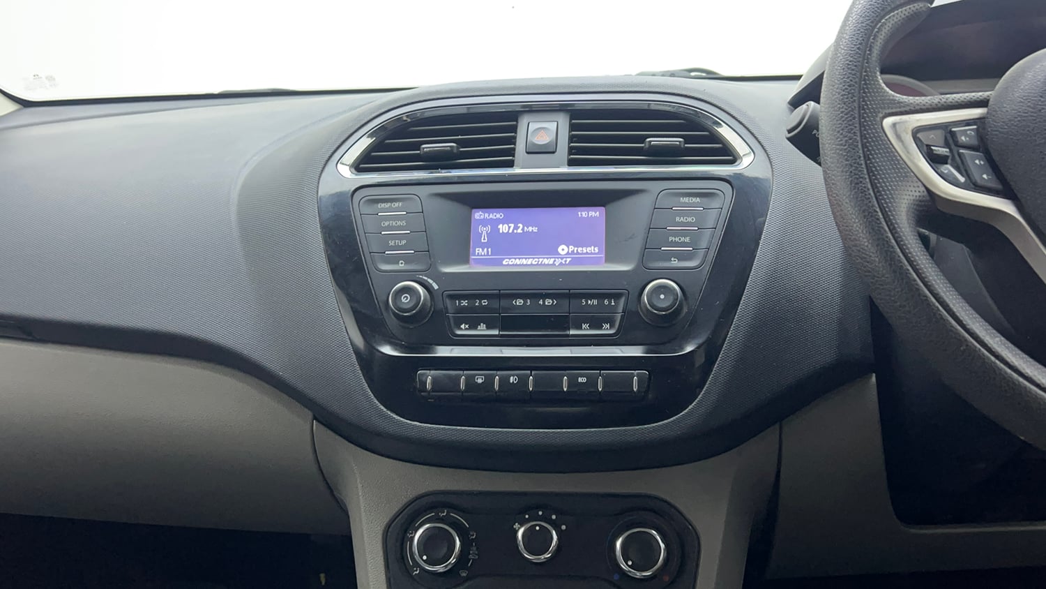 Used 2017 Tata Tiago Revotron XZ Petrol Manual top_features Integrated (in-dash) music system