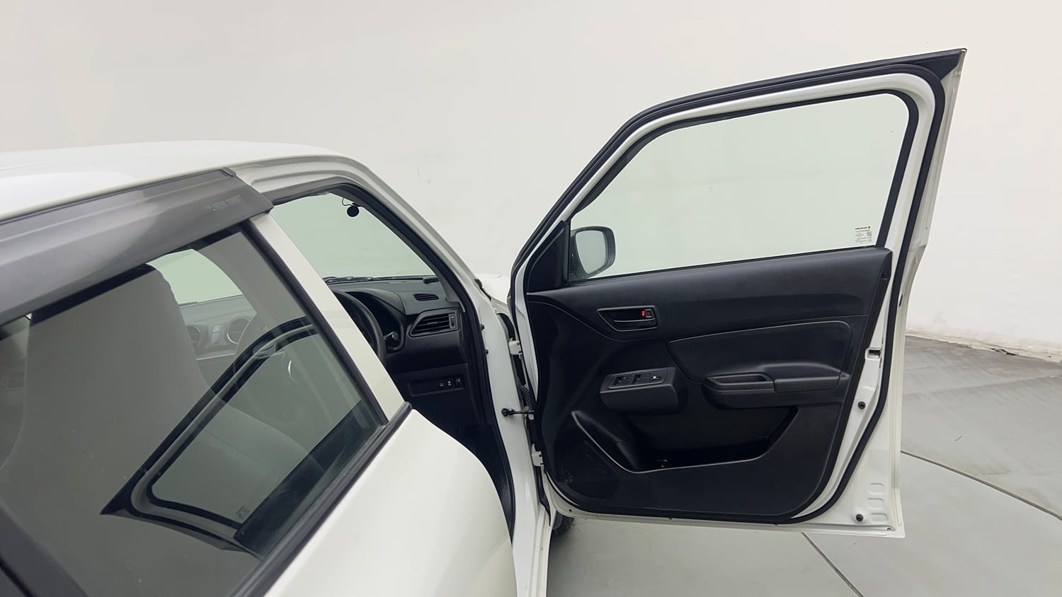 Used 2023 Maruti Suzuki Swift LXi Petrol Manual interior RIGHT FRONT DOOR OPEN VIEW