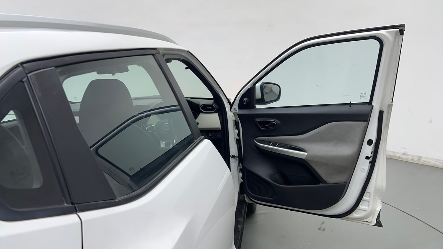 Used 2023 Nissan Magnite XE Petrol Manual interior RIGHT FRONT DOOR OPEN VIEW