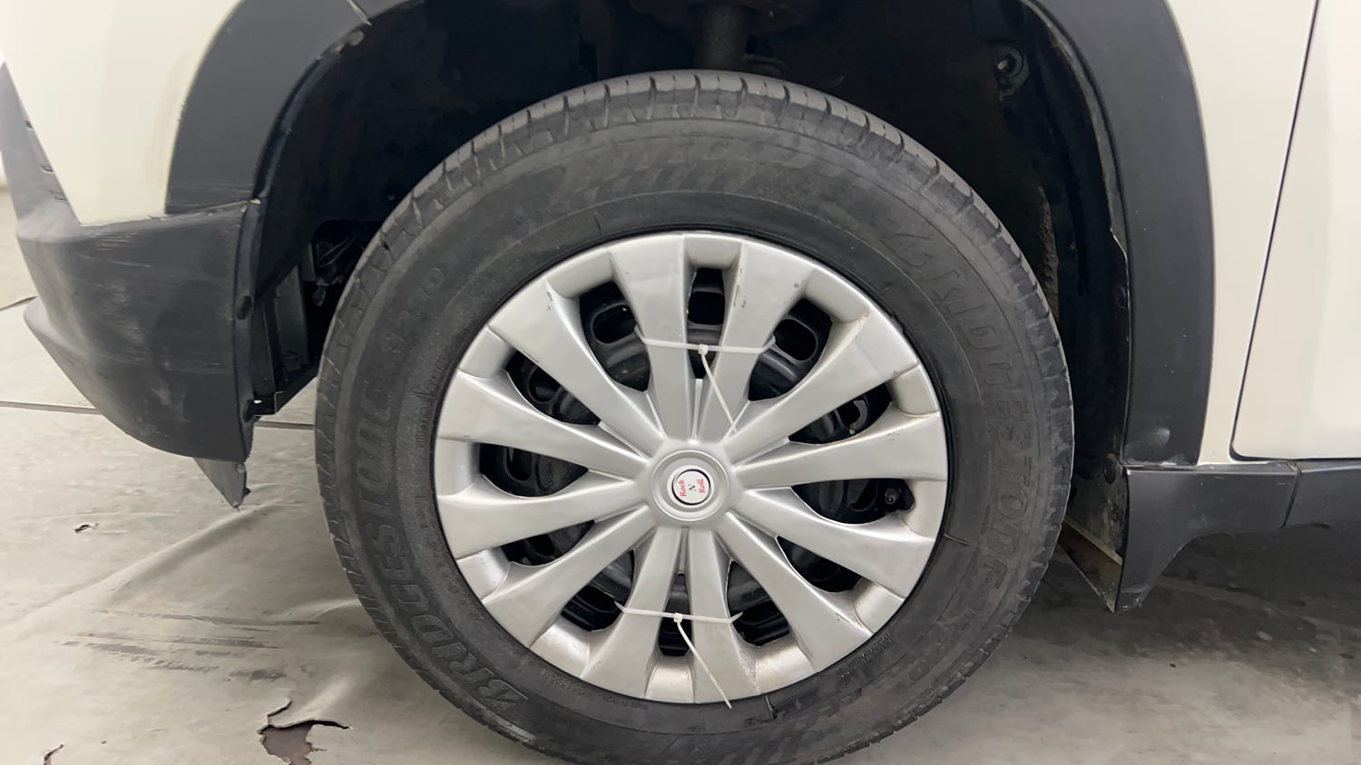 Used 2016 Mahindra KUV100 K4 6 STR Petrol Manual tyres LEFT FRONT TYRE RIM VIEW