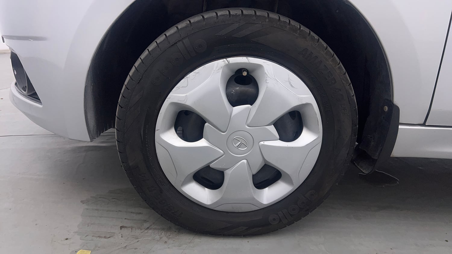 Used 2018 Tata Tiago Revotron XT Petrol Manual tyres LEFT FRONT TYRE RIM VIEW