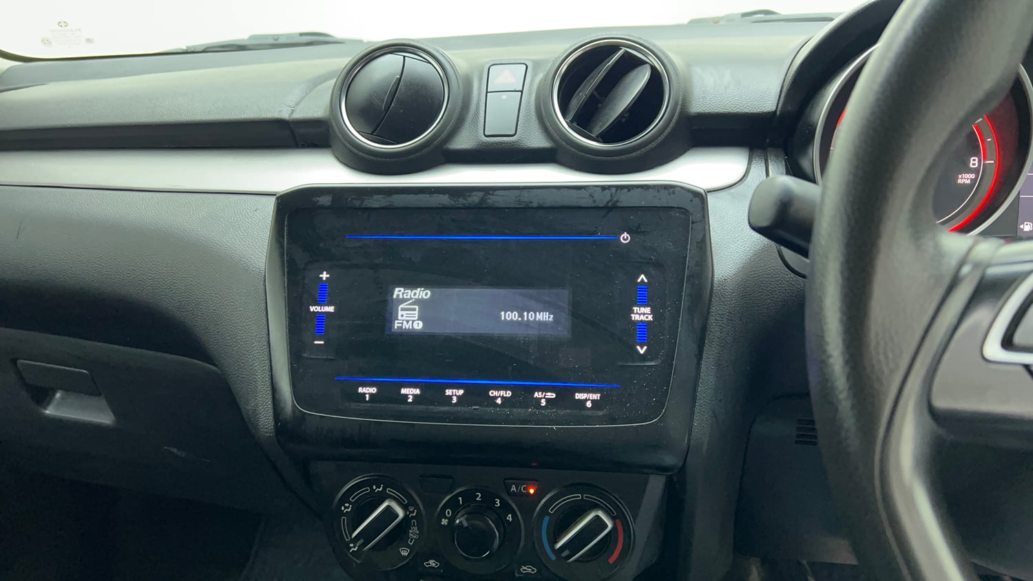Used 2022 Maruti Suzuki Swift VXi Petrol Manual top_features Integrated (in-dash) music system