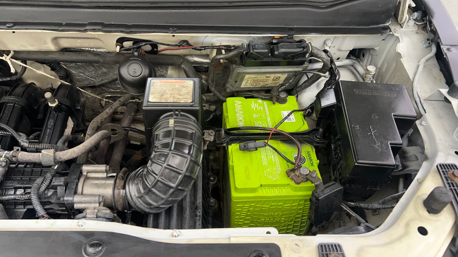 Used 2016 Mahindra KUV100 K4 6 STR Petrol Manual engine ENGINE LEFT SIDE VIEW