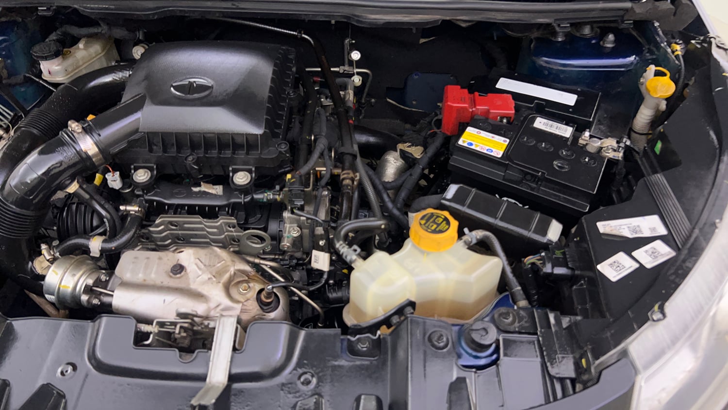 Used 2023 Tata Nexon XZ Plus LUXS Dual Tone Petrol Manual engine ENGINE LEFT SIDE VIEW