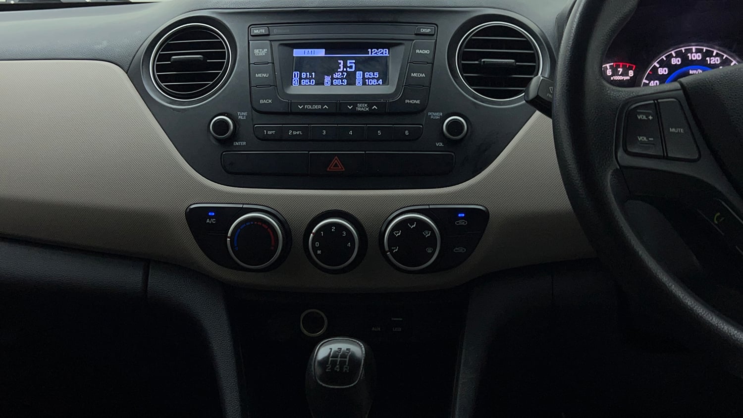 Used 2018 Hyundai Grand i10 Magna 1.2 Kappa VTVT Petrol Manual interior MUSIC SYSTEM & AC CONTROL VIEW
