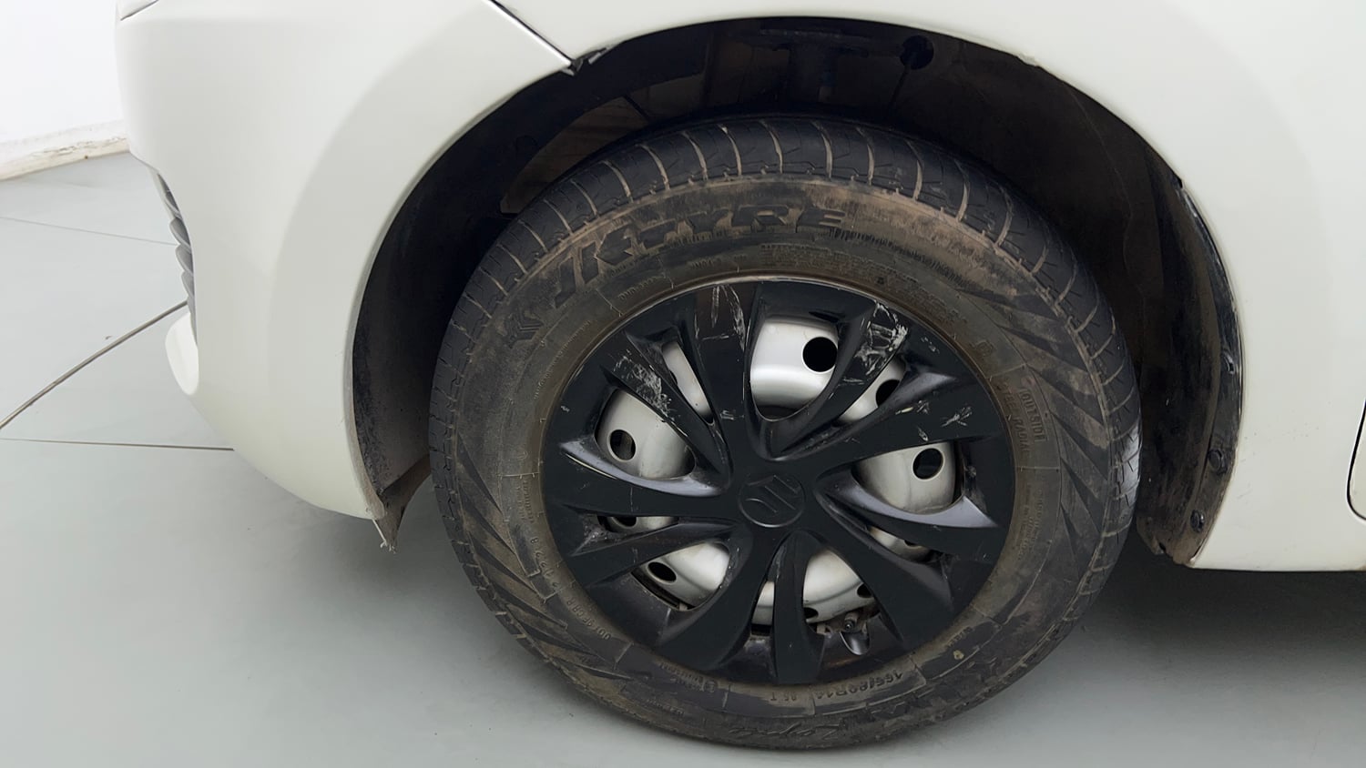 Used 2022 Maruti Suzuki Swift LXi Petrol Manual tyres LEFT FRONT TYRE RIM VIEW