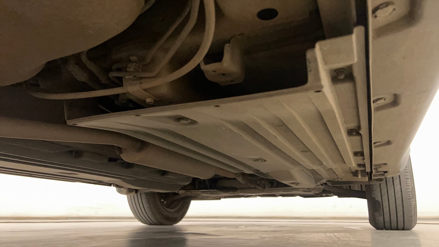 Used 2023 Maruti Suzuki Brezza VXi Petrol Manual extra REAR RIGHT UNDERBODY VIEW