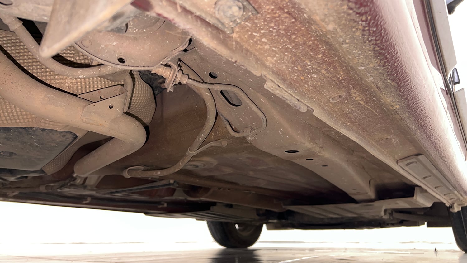 Used 2024 Maruti Suzuki Dzire ZXi Plus AMT Petrol Automatic extra REAR RIGHT UNDERBODY VIEW