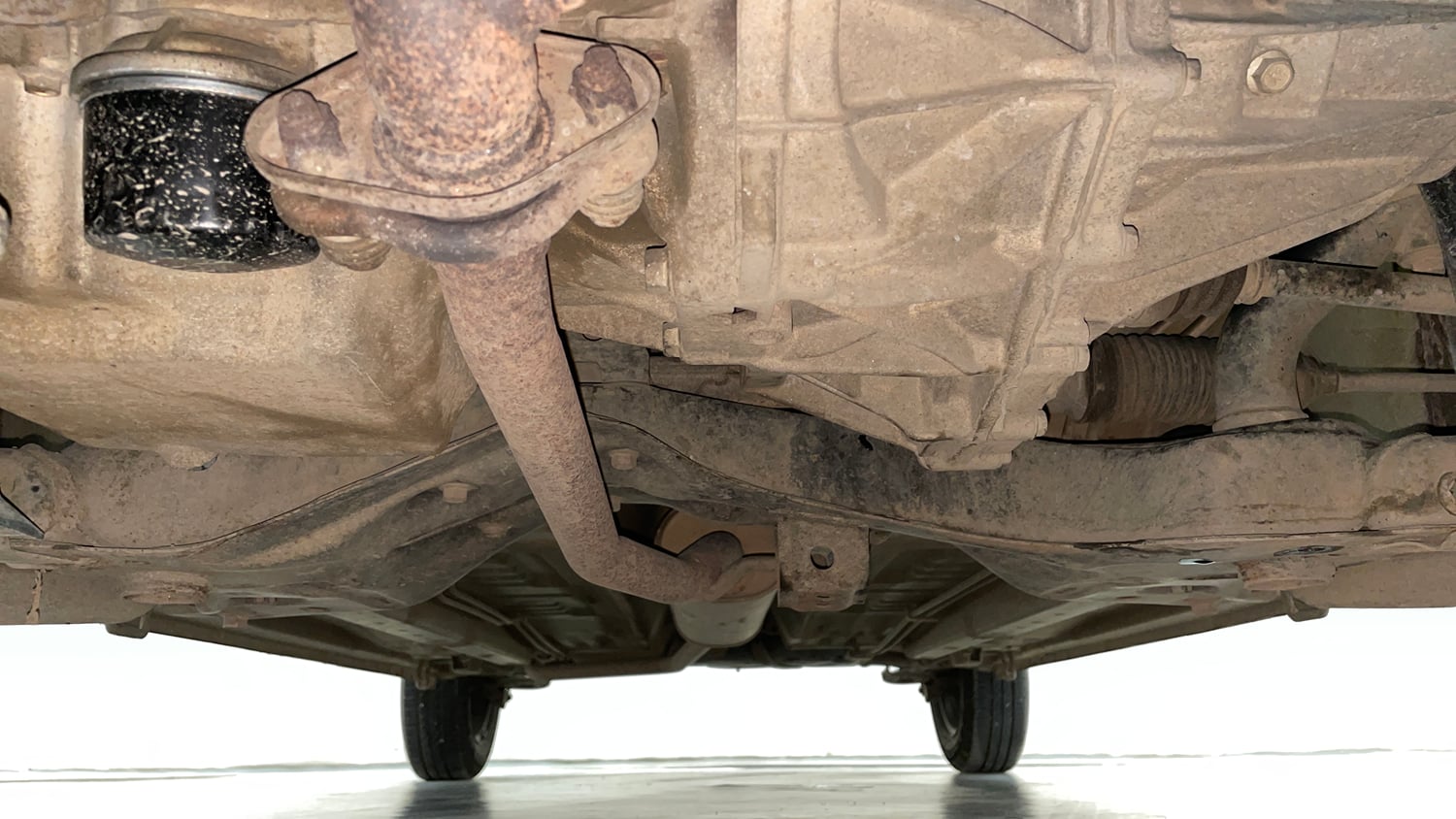 Used 2014 Maruti Suzuki Celerio VXi AMT Petrol Automatic extra FRONT LEFT UNDERBODY VIEW