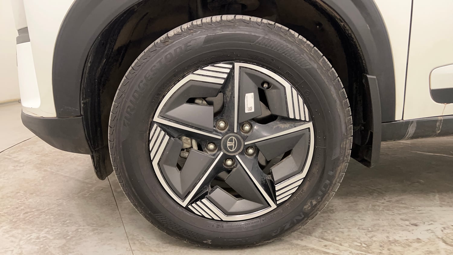 Used 2024 Tata Nexon Creative Plus S 1.2 Revotron Petrol 7DCA Petrol Automatic tyres LEFT FRONT TYRE RIM VIEW