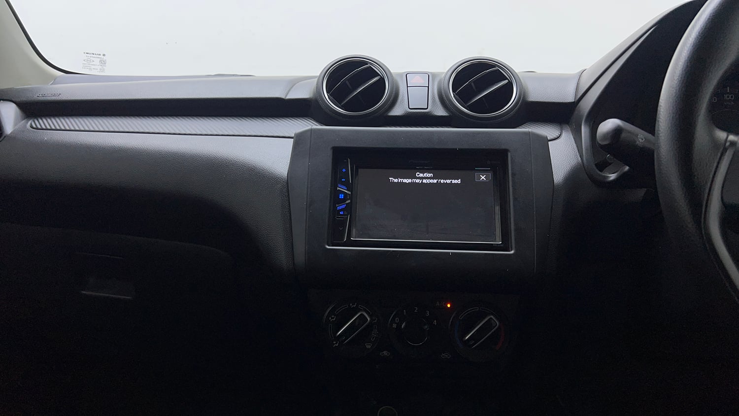 Used 2022 Maruti Suzuki Swift LXi Petrol Manual interior MUSIC SYSTEM & AC CONTROL VIEW