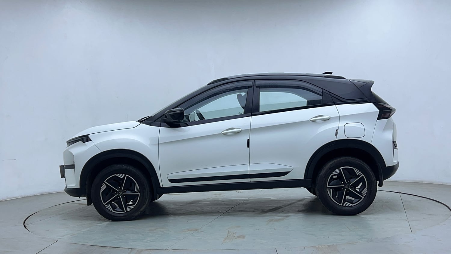 Used 2023 Tata Nexon Fearless Plus S 1.2 Revotron Petrol 7DCA DT Petrol Automatic exterior LEFT SIDE VIEW