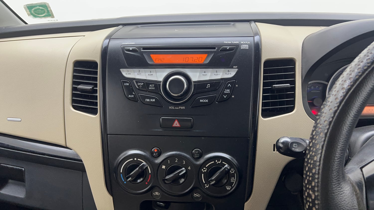 Used 2018 Maruti Suzuki Wagon R VXI Petrol Manual top_features Integrated (in-dash) music system