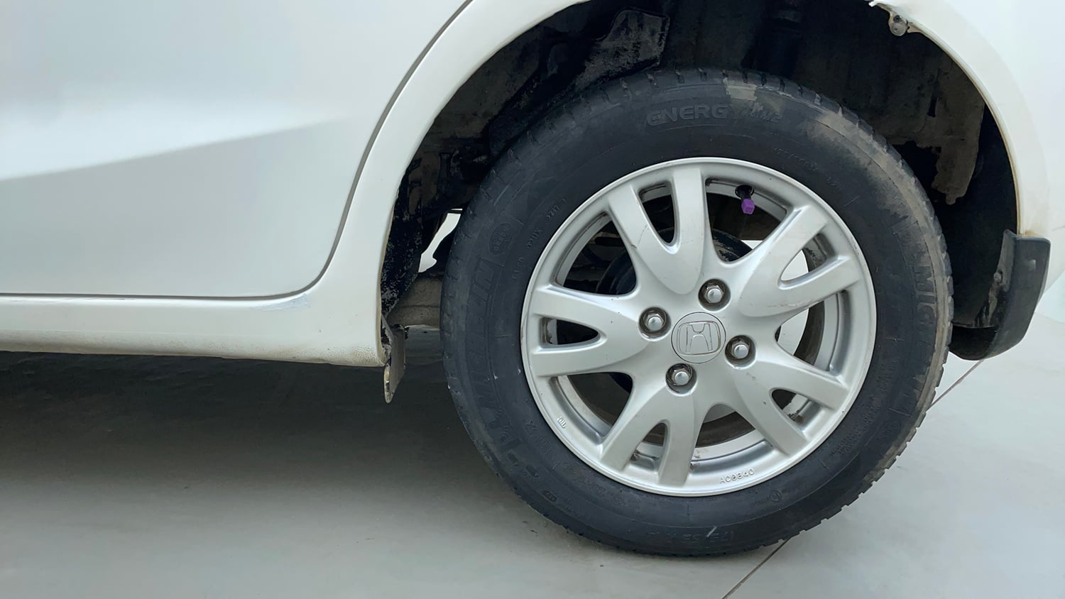 Used 2013 Honda Brio VX MT Petrol Manual tyres LEFT REAR TYRE RIM VIEW