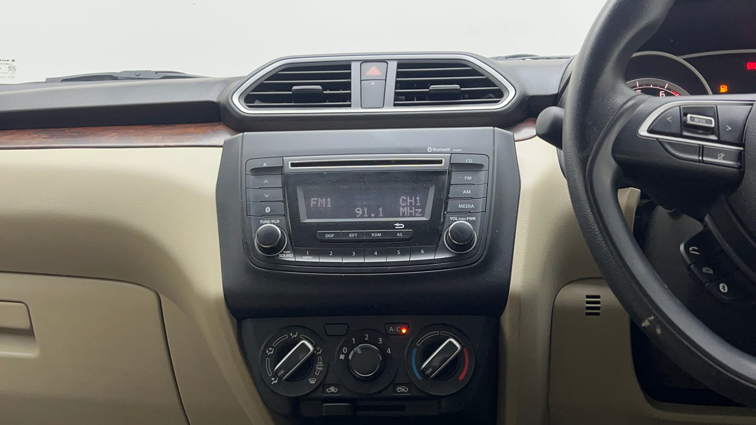 Used 2018 Maruti Suzuki Dzire VXi Petrol Manual top_features Integrated (in-dash) music system