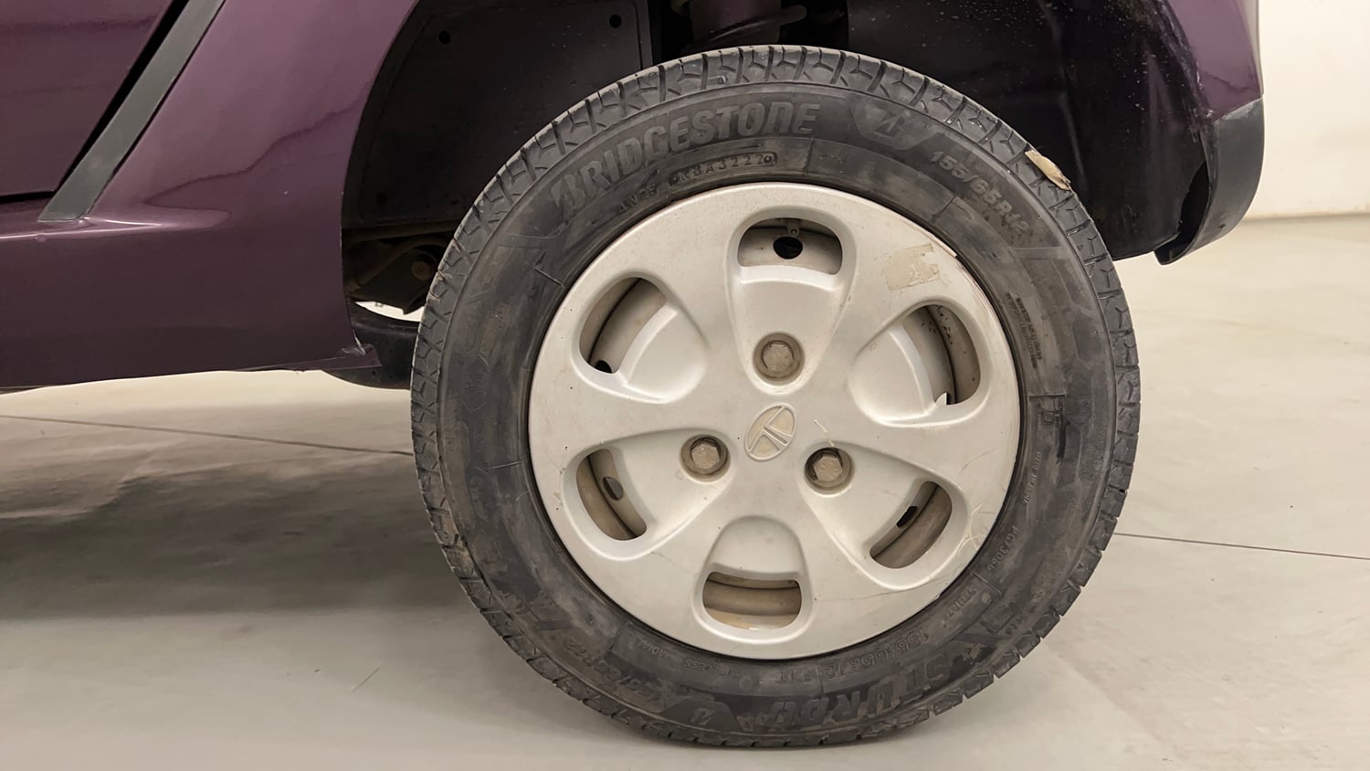 Used 2015 Tata Nano Twist XT Petrol Manual tyres LEFT REAR TYRE RIM VIEW