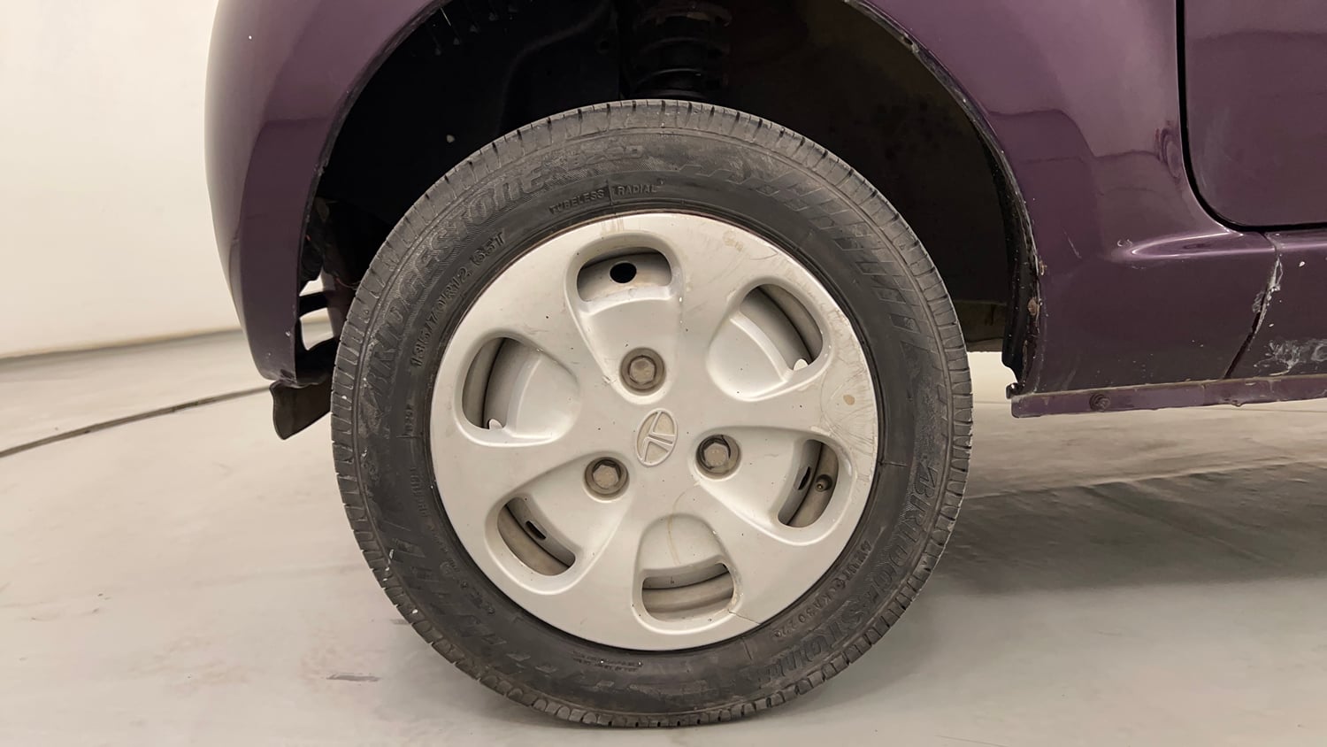 Used 2015 Tata Nano Twist XT Petrol Manual tyres LEFT FRONT TYRE RIM VIEW