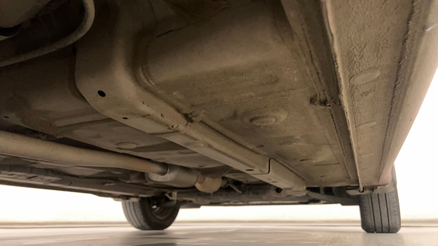 Used 2021 Hyundai Aura S 1.2 AMT Petrol Petrol Automatic extra REAR RIGHT UNDERBODY VIEW