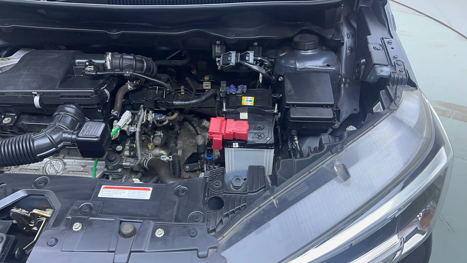 Used 2022 Maruti Suzuki XL6 Alpha Plus AT Petrol Petrol Automatic engine ENGINE LEFT SIDE VIEW