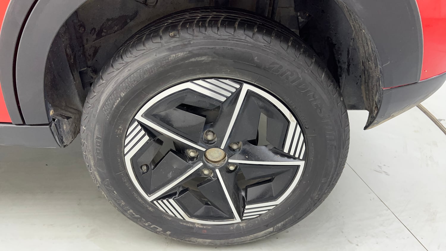 Used 2026 Tata Nexon Fearless Plus S 1.2 Revotron Petrol 7DCA DT Petrol Automatic tyres LEFT REAR TYRE RIM VIEW