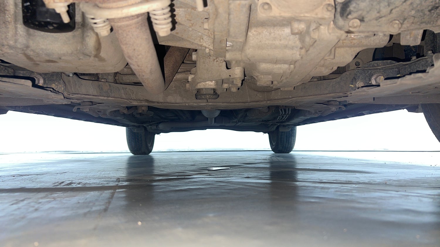 Used 2022 Maruti Suzuki XL6 Alpha Plus AT Petrol Petrol Automatic extra FRONT LEFT UNDERBODY VIEW