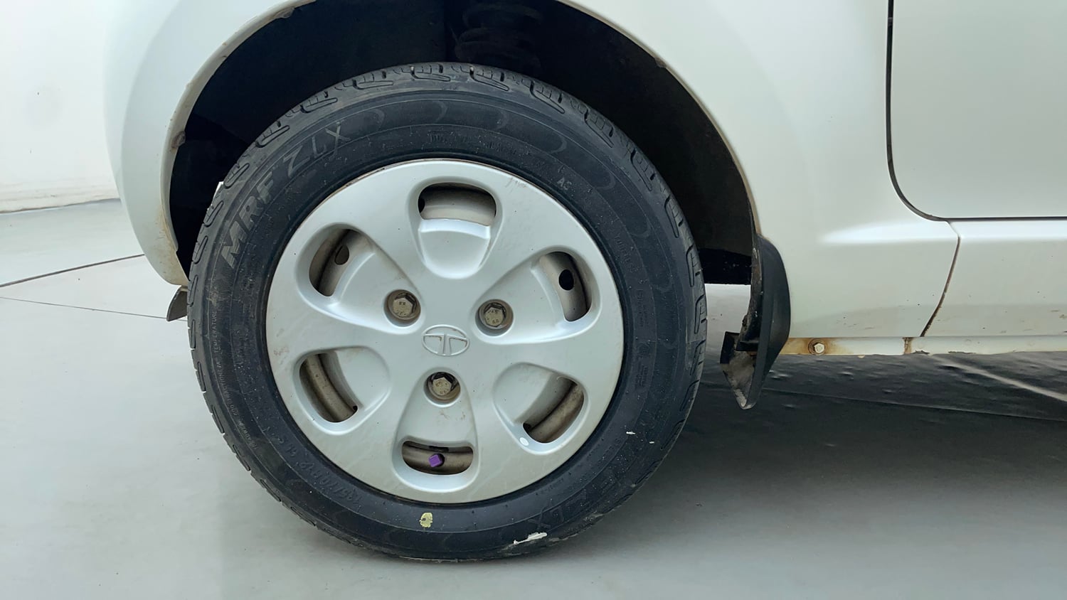 Used 2012 Tata Nano LX Petrol Manual tyres LEFT FRONT TYRE RIM VIEW