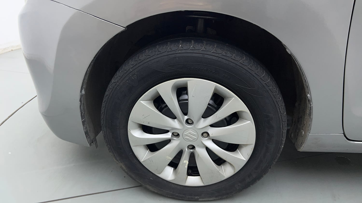 Used 2019 Maruti Suzuki Baleno Delta 1.2 Petrol Manual tyres LEFT FRONT TYRE RIM VIEW