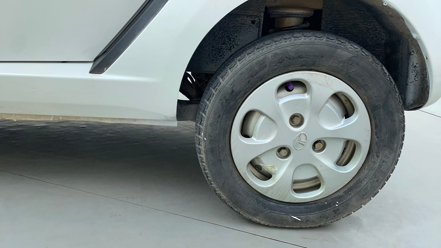 Used 2012 Tata Nano LX Petrol Manual tyres LEFT REAR TYRE RIM VIEW