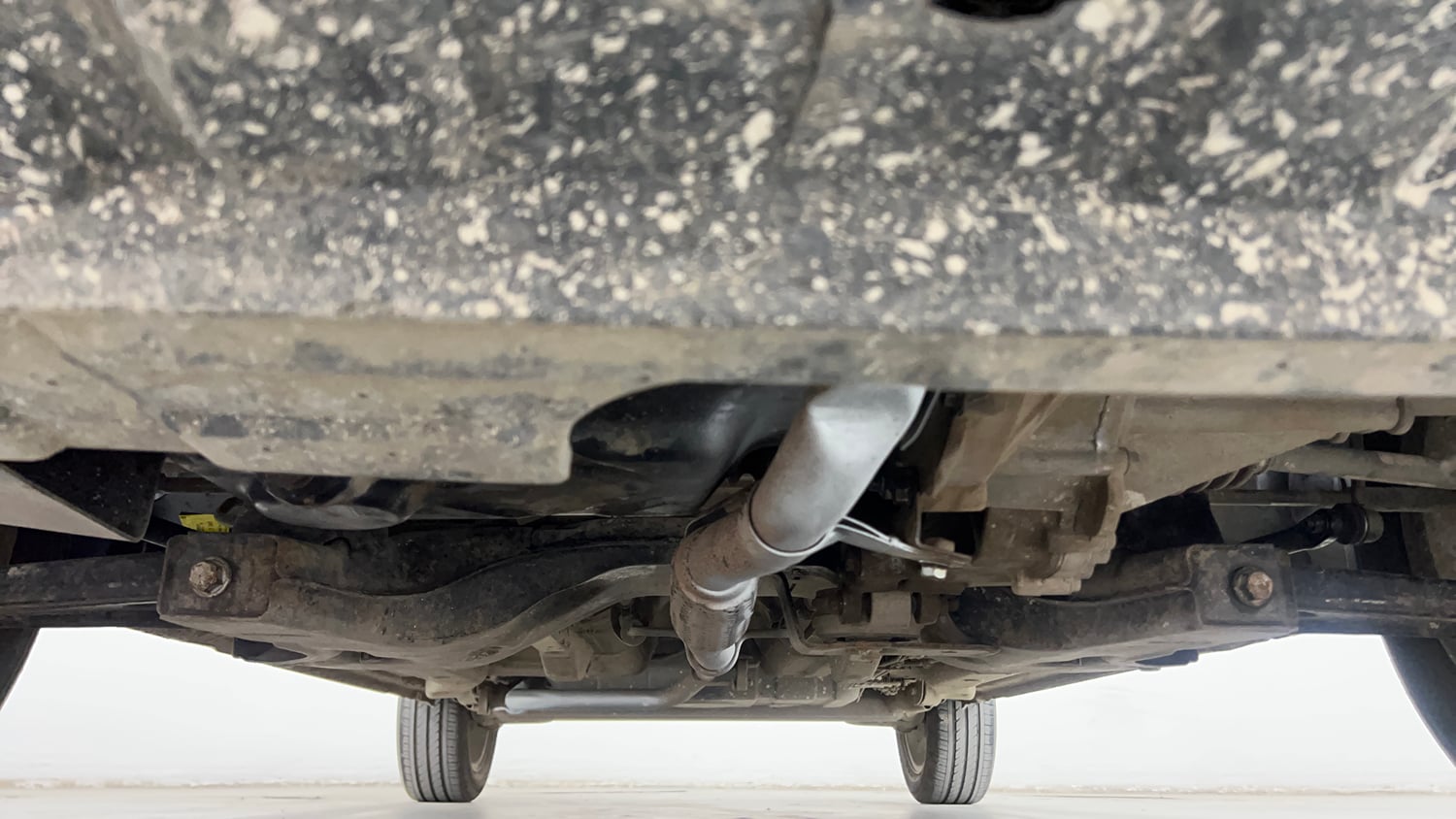 Used 2014 Tata Zest XMS Petrol Petrol Manual extra FRONT LEFT UNDERBODY VIEW