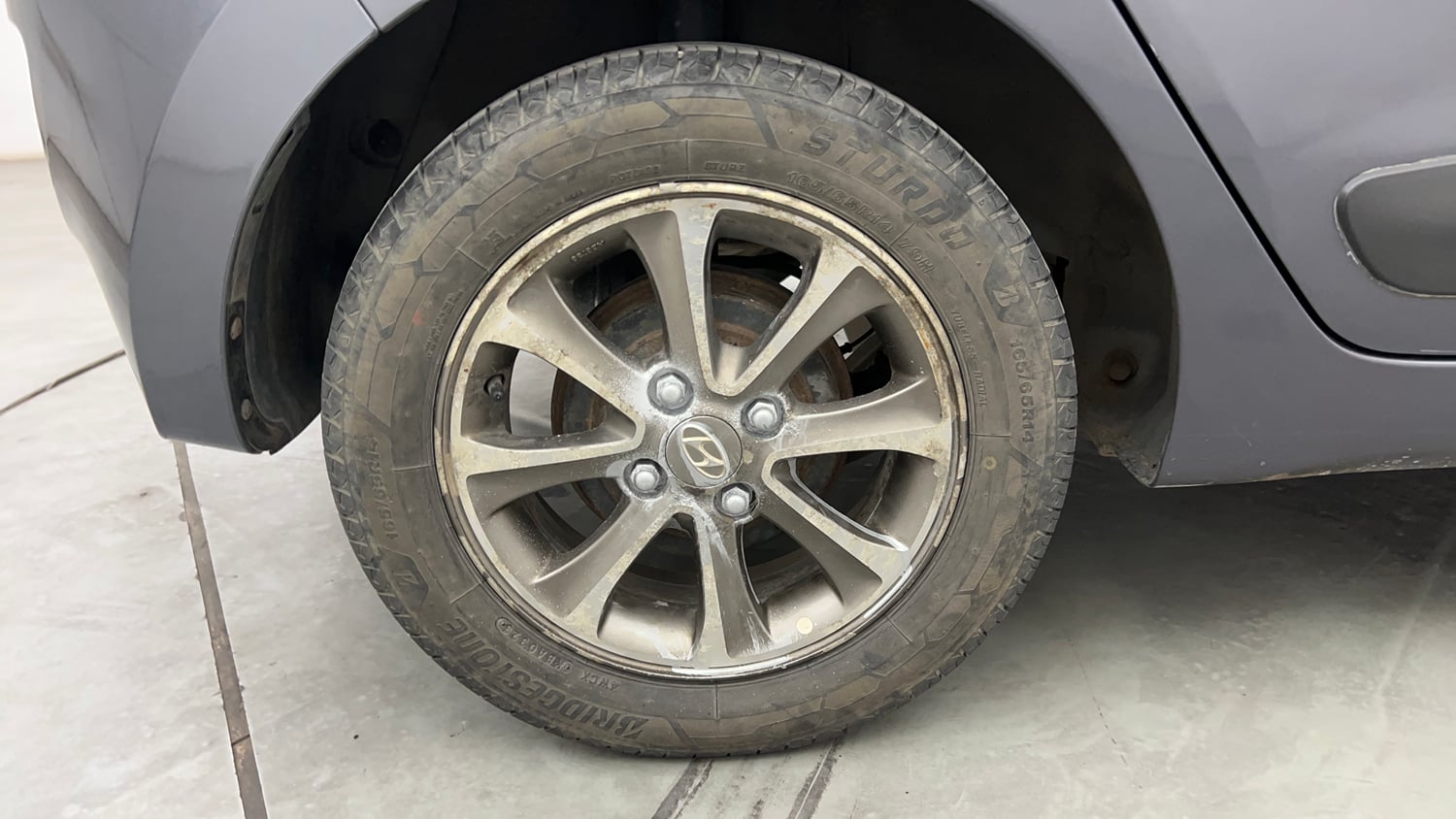 Used 2013 Hyundai Grand i10 Asta 1.2 Kappa VTVT Petrol Manual tyres RIGHT REAR TYRE RIM VIEW