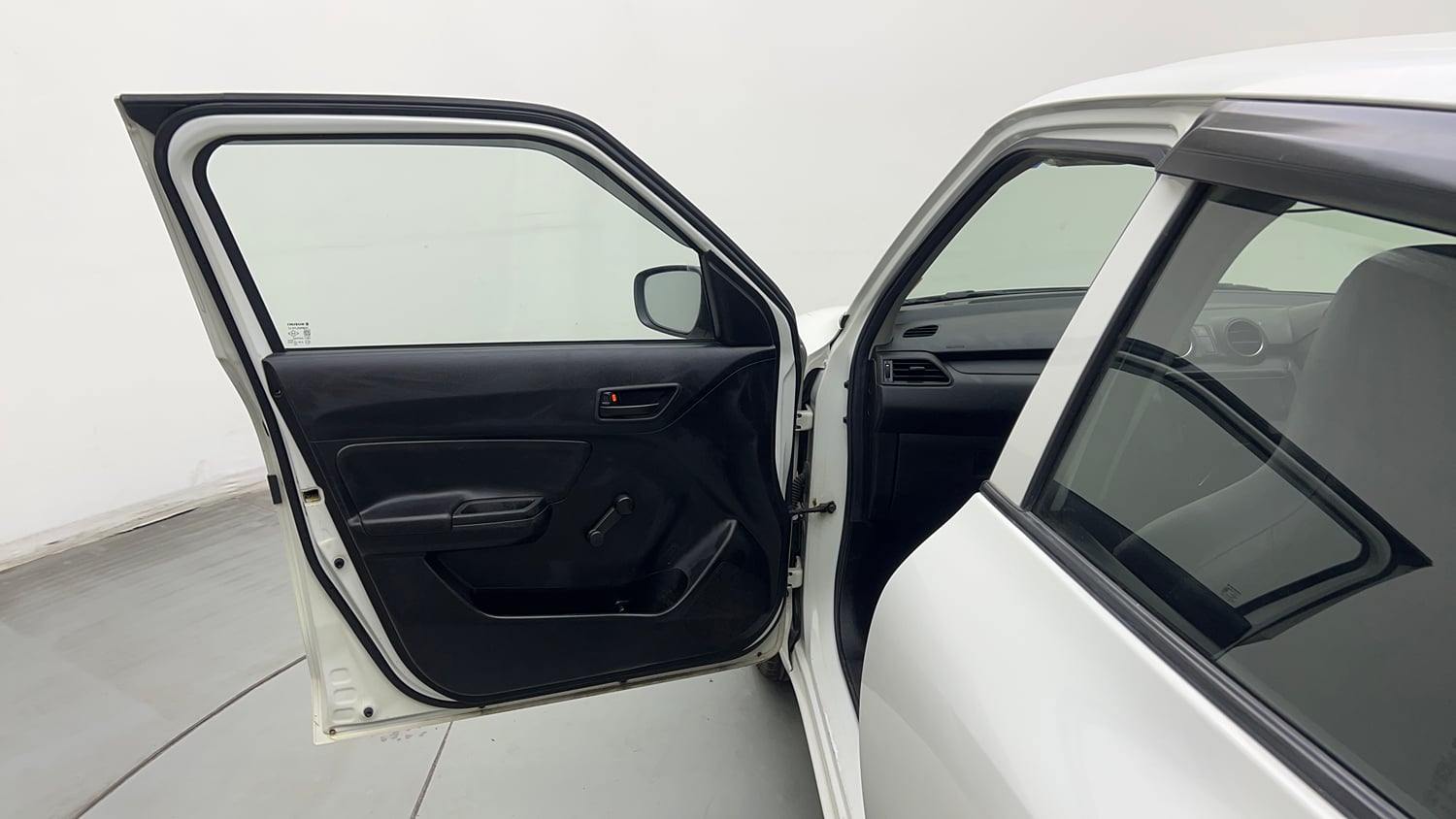 Used 2022 Maruti Suzuki Swift LXi Petrol Manual interior LEFT FRONT DOOR OPEN VIEW