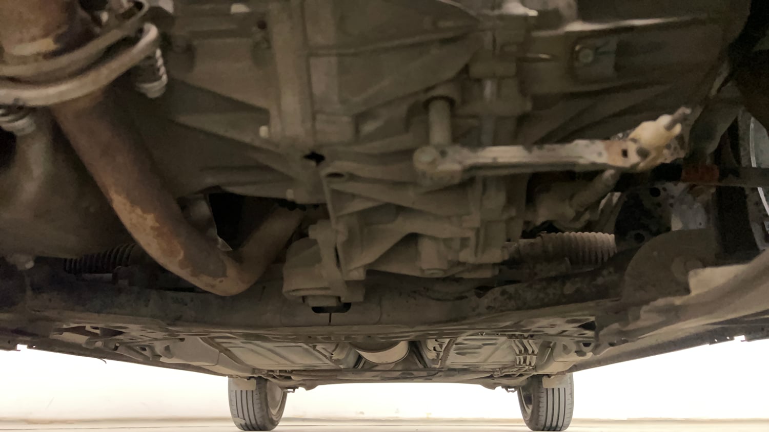 Used 2021 Maruti Suzuki Baleno Zeta Petrol Manual extra FRONT LEFT UNDERBODY VIEW