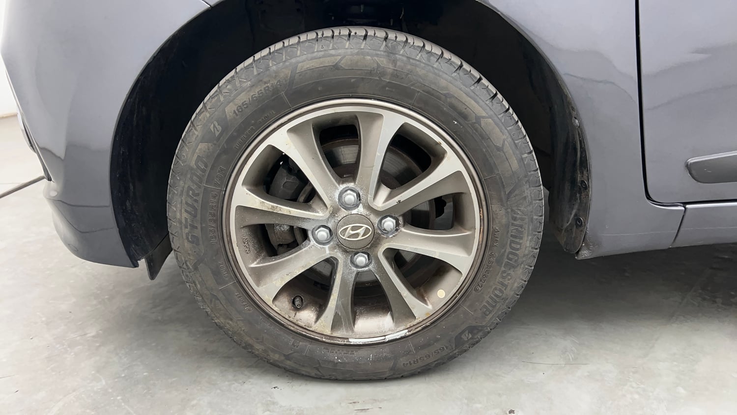 Used 2013 Hyundai Grand i10 Asta 1.2 Kappa VTVT Petrol Manual tyres LEFT FRONT TYRE RIM VIEW